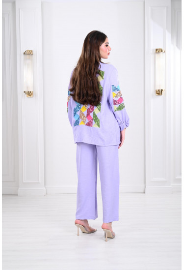 طقم نسائي مزين بشرائط حلزونية مطرزة