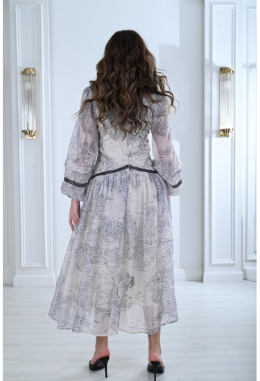 فستان بطباعات خريفية و تفاصيل دانتيل أنيقة