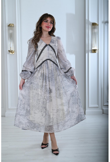 فستان بطباعات خريفية و تفاصيل دانتيل أنيقة