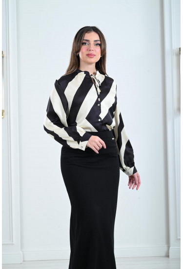 بلوزة نسائية أنيقة بتصميم منسدل