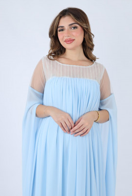  فستان فاخر بتصميم انسيابي ولمسات شفافة جذابة